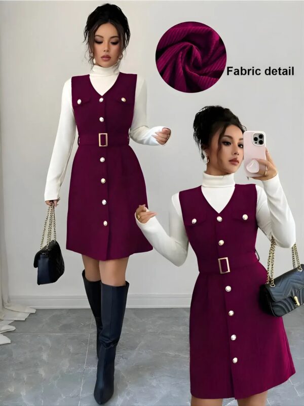 Woman wearing a purple dress with white buttons, standing next to a fabric swatch and holding a phone.